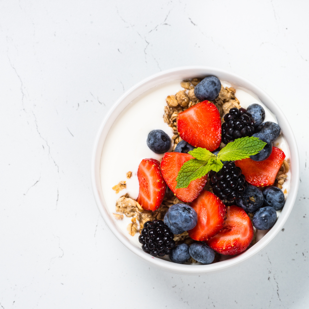 Greek yogurt with berries is not only satisfying but also helps combat inflammation associated with PCOS. Find more PCOS snack ideas in this blog post!